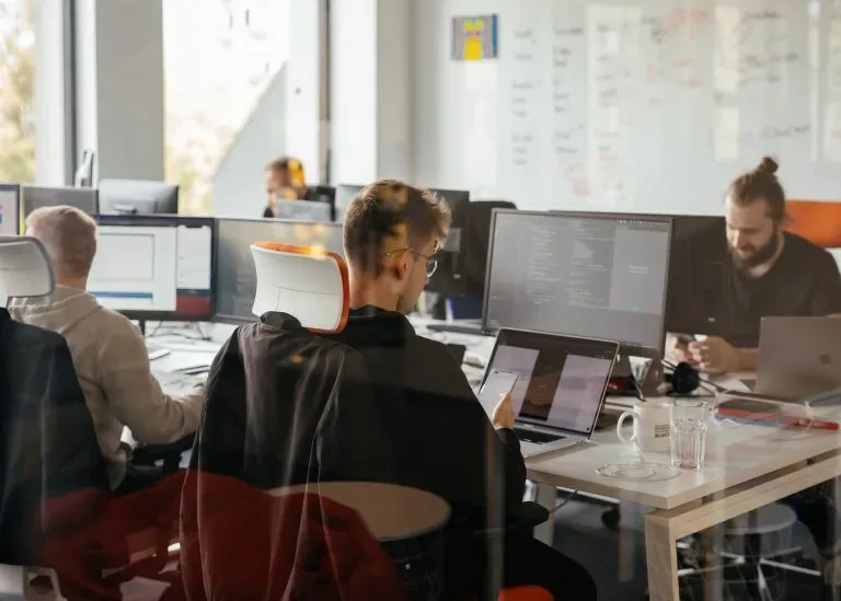 iteo engineers working at their desks in an open-plan office